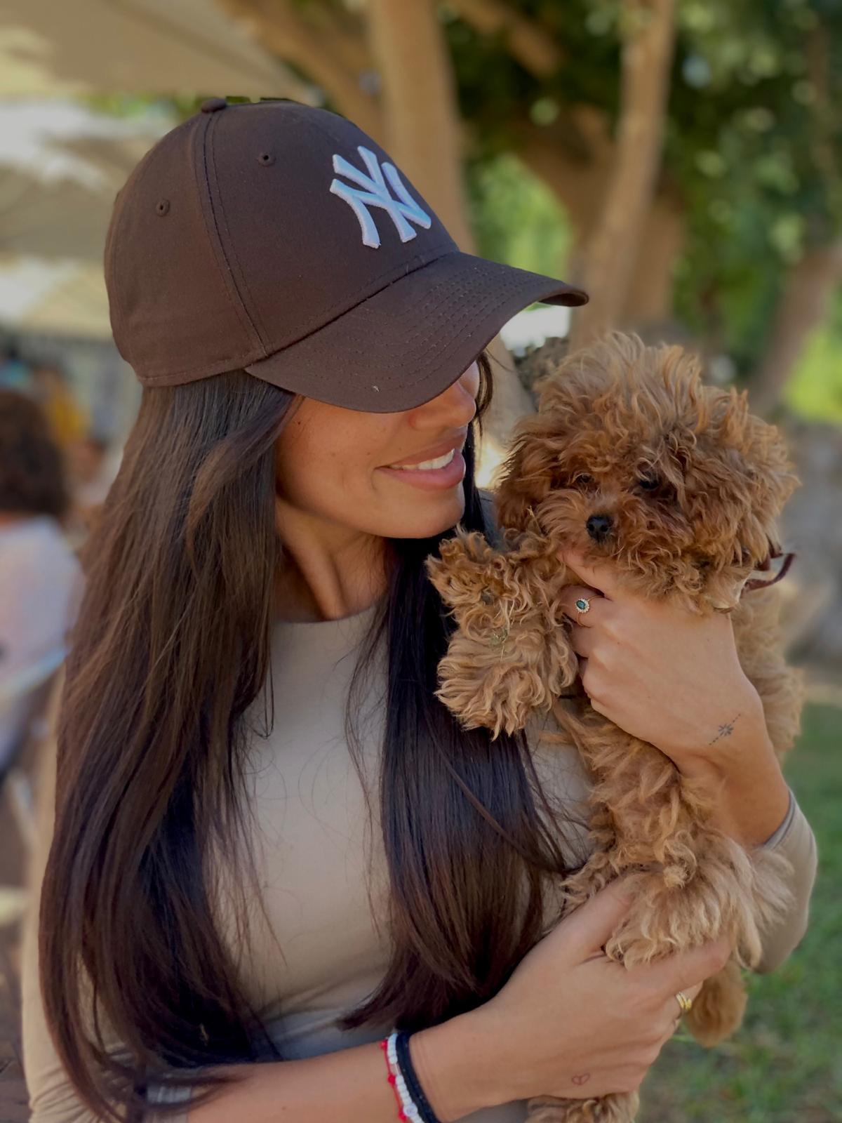 A man and his dog looking at each other.